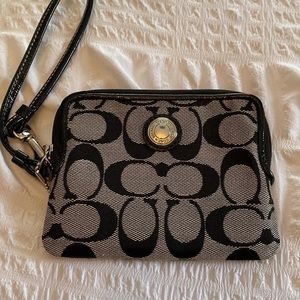 Coach wristlet. Black with hot pink interior.